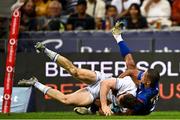 27 April 2024; Rob Russell of Leinster dives over to score his side's second try despite the tackle of Manie Libbok of DHL Stormers during the United Rugby Championship match between DHL Stormers and Leinster at the DHL Stadium in Cape Town, South Africa. Photo by Harry Murphy/Sportsfile