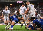 27 April 2024; Max Deegan of Leinster on his way to scoring his side's first try despite the tackle of Herschel Jantjies of DHL Stormers during the United Rugby Championship match between DHL Stormers and Leinster at the DHL Stadium in Cape Town, South Africa. Photo by Harry Murphy/Sportsfile