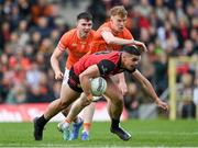 27 April 2024; Finn McElroy of Down in action against Conor Turbitt and Ben Crealey, left, of Armagh during the Ulster GAA Football Senior Championship semi-final match between Down and Armagh at St Tiernach's Park in Clones, Monaghan. Photo by Stephen McCarthy/Sportsfile