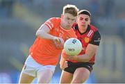 27 April 2024; Conor Turbitt of Armagh is tackled by Finn McElroy of Down during the Ulster GAA Football Senior Championship semi-final match between Down and Armagh at St Tiernach's Park in Clones, Monaghan. Photo by Stephen McCarthy/Sportsfile