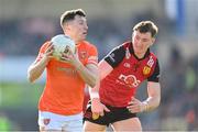 27 April 2024; Oisin Conaty of Armagh in action against Ryan McEvoy of Down during the Ulster GAA Football Senior Championship semi-final match between Down and Armagh at St Tiernach's Park in Clones, Monaghan. Photo by Stephen McCarthy/Sportsfile