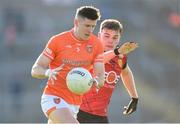 27 April 2024; Joe McElroy of Armagh in action against Ryan Magill of Down during the Ulster GAA Football Senior Championship semi-final match between Down and Armagh at St Tiernach's Park in Clones, Monaghan. Photo by Stephen McCarthy/Sportsfile