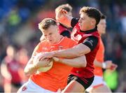 27 April 2024; Rian O'Neill of Armagh in action against Pierce Laverty of Down during the Ulster GAA Football Senior Championship semi-final match between Down and Armagh at St Tiernach's Park in Clones, Monaghan. Photo by Stephen McCarthy/Sportsfile