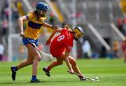 28 April 2024; Ethan Twomey of Cork is tackled by Áine O'Loughlin of Clare during the Munster Senior Camogie Championship semi-final match between Cork and Clare at SuperValu Páirc Ui Chaoimh in Cork. Photo by Ray McManus/Sportsfile