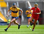 28 April 2024; Aine O’Loughlin of Clare and Aoife Healy of Cork in a race for possession during the Munster Senior Camogie Championship semi-final match between Cork and Clare at SuperValu Páirc Ui Chaoimh in Cork. Photo by Ray McManus/Sportsfile