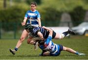 28 April 2024; Emma Walsh of Wexford RFC is tackled by Vivienne Harris of Athy RFC during the Leinster Girls U18 semi-final match between Athy RFC and Wexford RFC at Athy RFC in Kildare. Photo by Michael P Ryan/Sportsfile
