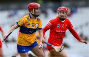 28 April 2024; Jennifer Daly of Clare is tackled by Libby Coppinger of Cork during the Munster Senior Camogie Championship semi-final match between Cork and Clare at SuperValu Páirc Ui Chaoimh in Cork. Photo by Ray McManus/Sportsfile