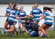 28 April 2024; Emma Walsh of Wexford RFC is tackled by Grace Moore of Athy RFC during the Leinster Girls U18 semi-final match between Athy RFC and Wexford RFC at Athy RFC in Kildare. Photo by Michael P Ryan/Sportsfile
