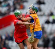 28 April 2024; Hannah Looney of Cork is tackled by Niamh Mulqueen of Clare during the Munster Senior Camogie Championship semi-final match between Cork and Clare at SuperValu Páirc Ui Chaoimh in Cork. Photo by Ray McManus/Sportsfile