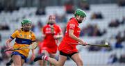 28 April 2024; Hannah Looney of Cork races clear of Labhaoise O’Donnell of Clare during the Munster Senior Camogie Championship semi-final match between Cork and Clare at SuperValu Páirc Ui Chaoimh in Cork. Photo by Ray McManus/Sportsfile