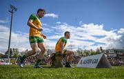 28 April 2024; Patrick McBrearty, right, and Shane O'Donnell of Donegal prepare for their squad photograph before the Ulster GAA Football Senior Championship semi-final match between Donegal and Tyrone at Celtic Park in Derry. Photo by Stephen McCarthy/Sportsfile