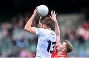 28 April 2024; Kevin Feely of Kildare wins possession ahead of Peter Lynch of Louth during the Leinster GAA Football Senior Championship semi-final match between Kildare and Louth at Croke Park in Dublin. Photo by Piaras Ó Mídheach/Sportsfile