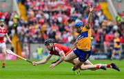 28 April 2024; Shane O'Donnell of Clare is tackled by Eoin Downey of Cork during the Munster GAA Hurling Senior Championship Round 2 match between Cork and Clare at SuperValu Páirc Ui Chaoimh in Cork. Photo by Ray McManus/Sportsfile