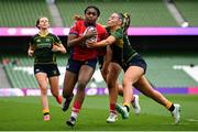 28 April 2024; Chisom Ugwueru of UL Bohemian on her way to scoring her side's second try, despite the tackle of Railway Union's Kayla Waldron, during the Energia All-Ireland League Women's Division 1 final match between UL Bohemian and Railway Union at the Aviva Stadium in Dublin. Photo by Seb Daly/Sportsfile