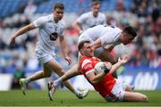 28 April 2024; Sam Mulroy of Louth is tackled by Mick O'Grady of Kildare during the Leinster GAA Football Senior Championship semi-final match between Kildare and Louth at Croke Park in Dublin. Photo by Shauna Clinton/Sportsfile