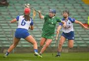 28 April 2024; Lorraine McCarthy of Limerick in action against Clodagh Carroll, left, and Alannah McNulty of Waterford during the Munster Senior Camogie Championship quarter-final match between Limerick and Waterford at TUS Gaelic Grounds in Limerick. Photo by Brendan Moran/Sportsfile