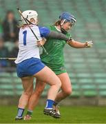 28 April 2024; Lorraine McCarthy of Limerick is tackled by Waterford goalkeeper Brianna O'Regan resulting in a penalty during the Munster Senior Camogie Championship quarter-final match between Limerick and Waterford at TUS Gaelic Grounds in Limerick. Photo by Brendan Moran/Sportsfile