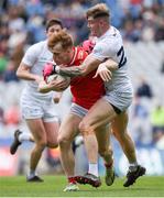 28 April 2024; Ciaran Keenan of Louth is tackled by Kevin O’Callaghan of Kildare during the Leinster GAA Football Senior Championship semi-final match between Kildare and Louth at Croke Park in Dublin. Photo by Shauna Clinton/Sportsfile
