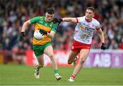 28 April 2024; Niall O'Donnell of Donegal is tackled by Conn Kilpatrick of Tyrone during the Ulster GAA Football Senior Championship semi-final match between Donegal and Tyrone at Celtic Park in Derry. Photo by Stephen McCarthy/Sportsfile