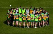 28 April 2024; Donegal manager Jim McGuinness speaks to his players in a huddle before the Ulster GAA Football Senior Championship semi-final match between Donegal and Tyrone at Celtic Park in Derry. Photo by Stephen McCarthy/Sportsfile