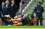 28 April 2024; Aoife Corey of UL Bohemian scores her side's fourth try, despite the tackle of Railway Union's Aimee Clarke, during the Energia All-Ireland League Women's Division 1 final match between UL Bohemian and Railway Union at the Aviva Stadium in Dublin. Photo by Seb Daly/Sportsfile