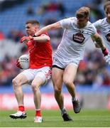 28 April 2024; Conall McKeever of Louth in action against Kevin O’Callaghan of Kildare during the Leinster GAA Football Senior Championship semi-final match between Kildare and Louth at Croke Park in Dublin. Photo by Shauna Clinton/Sportsfile