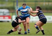 28 April 2024; Anna Harrington of Athy RFC is tackled by Shannon Codd, left, and Ella Banville of Wexford RFC during the Leinster Girls U18 semi-final match between Athy RFC and Wexford RFC at Athy RFC in Kildare. Photo by Michael P Ryan/Sportsfile