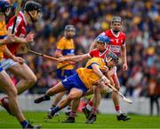 28 April 2024; David Reidy of Clare is tackled by Sean O Donoghue of Cork during the Munster GAA Hurling Senior Championship Round 2 match between Cork and Clare at SuperValu Páirc Ui Chaoimh in Cork. Photo by Ray McManus/Sportsfile