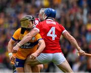 28 April 2024; David Reidy of Clare is tackled by Sean O Donoghue of Cork during the Munster GAA Hurling Senior Championship Round 2 match between Cork and Clare at SuperValu Páirc Ui Chaoimh in Cork. Photo by Ray McManus/Sportsfile