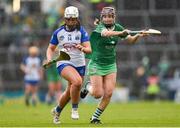 28 April 2024; Roisín Kirwan of Waterford in action against Teresa Dore of Limerick during the Munster Senior Camogie Championship quarter-final match between Limerick and Waterford at TUS Gaelic Grounds in Limerick. Photo by Tom Beary/Sportsfile