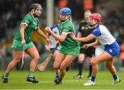 28 April 2024; Lizanna Boylan of Limerick is tackled by Clodagh Carroll of Waterford during the Munster Senior Camogie Championship quarter-final match between Limerick and Waterford at TUS Gaelic Grounds in Limerick. Photo by Tom Beary/Sportsfile