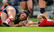 28 April 2024; Lindsay Peat of Railway Union scores her side's fifth try, despite the tackle of UL Bohemian's Muirne Wall, during the Energia All-Ireland League Women's Division 1 final match between UL Bohemian and Railway Union at the Aviva Stadium in Dublin. Photo by Seb Daly/Sportsfile