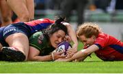28 April 2024; Lindsay Peat of Railway Union scores her side's fifth try, despite the tackle of UL Bohemian's Muirne Wall, during the Energia All-Ireland League Women's Division 1 final match between UL Bohemian and Railway Union at the Aviva Stadium in Dublin. Photo by Seb Daly/Sportsfile
