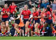 28 April 2024; UL Bohemian players Kate Flannery, centre, and Muirne Wall celebrate during the Energia All-Ireland League Women's Division 1 final match between UL Bohemian and Railway Union at the Aviva Stadium in Dublin. Photo by Seb Daly/Sportsfile