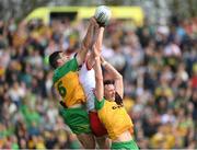 28 April 2024; Caolan McGonagle, left, and Jason McGee of Donegal in action against Brian Kennedy of Tyrone during the Ulster GAA Football Senior Championship semi-final match between Donegal and Tyrone at Celtic Park in Derry. Photo by Stephen McCarthy/Sportsfile