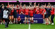 28 April 2024; UL Bohemian captain Chloe Pearse, left, and teammate Fiona Reidy lift the trophy and celebrate alongside teammates after their side's victory in the Energia All-Ireland League Women's Division 1 final match between UL Bohemian and Railway Union at the Aviva Stadium in Dublin. Photo by Seb Daly/Sportsfile