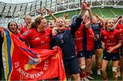 28 April 2024; UL Bohemian head coach Fiona Hayes, centre, and Fiona Reidy celebrate alongside teammates after their side's victory in the Energia All-Ireland League Women's Division 1 final match between UL Bohemian and Railway Union at the Aviva Stadium in Dublin. Photo by Seb Daly/Sportsfile