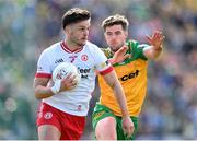 28 April 2024; Michael McKernan of Tyrone in action against Daire Ó Baoill of Donegal during the Ulster GAA Football Senior Championship semi-final match between Donegal and Tyrone at Celtic Park in Derry. Photo by Stephen McCarthy/Sportsfile