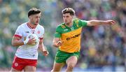 28 April 2024; Michael McKernan of Tyrone in action against Daire Ó Baoill of Donegal during the Ulster GAA Football Senior Championship semi-final match between Donegal and Tyrone at Celtic Park in Derry. Photo by Stephen McCarthy/Sportsfile