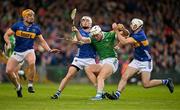 28 April 2024; Kyle Hayes of Limerick is tackled by Tipperary players Ronan Maher, Johnny Ryan and Craig Morgan during the Munster GAA Hurling Senior Championship Round 2 match between Limerick and Tipperary at TUS Gaelic Grounds in Limerick. Photo by Brendan Moran/Sportsfile