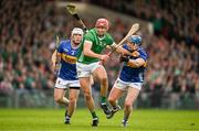 28 April 2024; Barry Nash of Limerick is tackled by Willie Connors and Johnny Ryan of Tipperary during the Munster GAA Hurling Senior Championship Round 2 match between Limerick and Tipperary at TUS Gaelic Grounds in Limerick. Photo by Brendan Moran/Sportsfile