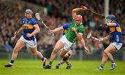 28 April 2024; Barry Nash of Limerick is tackled by Jason Forde, Willie Connors and Johnny Ryan of Tipperary during the Munster GAA Hurling Senior Championship Round 2 match between Limerick and Tipperary at TUS Gaelic Grounds in Limerick. Photo by Brendan Moran/Sportsfile