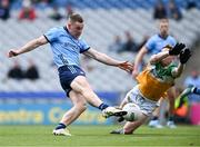 28 April 2024; Con O'Callaghan of Dublin scores his side's first goal, under pressure from Lee Pearson of Offaly,  during the Leinster GAA Football Senior Championship semi-final match between Dublin and Offaly at Croke Park in Dublin. Photo by Piaras Ó Mídheach/Sportsfile