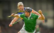 28 April 2024; Peter Casey of Limerick in action against Bryan O'Mara of Tipperary during the Munster GAA Hurling Senior Championship Round 2 match between Limerick and Tipperary at TUS Gaelic Grounds in Limerick. Photo by Brendan Moran/Sportsfile