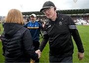 28 April 2024; Clare manager Brian Lohan is congratulated by Deirdre Murphy, Head of Operations Clare GAA, after the Munster GAA Hurling Senior Championship Round 2 match between Cork and Clare at SuperValu Ui Chaoimh in Cork. Photo by Ray McManus/Sportsfile