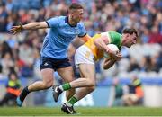 28 April 2024; Jordan Hayes of Offaly is tackled by John Small of Dublin during the Leinster GAA Football Senior Championship semi-final match between Dublin and Offaly at Croke Park in Dublin. Photo by Shauna Clinton/Sportsfile