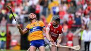 28 April 2024; Peter Duggan of Clare is tackled by Damien Cahalane of Cork during the Munster GAA Hurling Senior Championship Round 2 match between Cork and Clare at SuperValu Páirc Ui Chaoimh in Cork. Photo by Ray McManus/Sportsfile