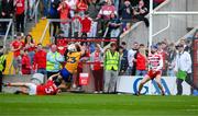 28 April 2024; Aron Shanagher of Clare, under pressure from Cork full-back Eoin Downey, shoots past Cork goalkeeper Patrick Collins to score his side's third goal during the Munster GAA Hurling Senior Championship Round 2 match between Cork and Clare at SuperValu Páirc Ui Chaoimh in Cork. Photo by Ray McManus/Sportsfile