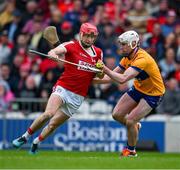 28 April 2024; Alan Connolly of Cork is tackled by Adam Hogan of Clare during the Munster GAA Hurling Senior Championship Round 2 match between Cork and Clare at SuperValu Páirc Ui Chaoimh in Cork. Photo by Ray McManus/Sportsfile