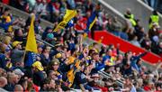 28 April 2024; Clare supporters, amongst the 36,814 attendance, celebrate a score during the Munster GAA Hurling Senior Championship Round 2 match between Cork and Clare at SuperValu Páirc Ui Chaoimh in Cork. Photo by Ray McManus/Sportsfile